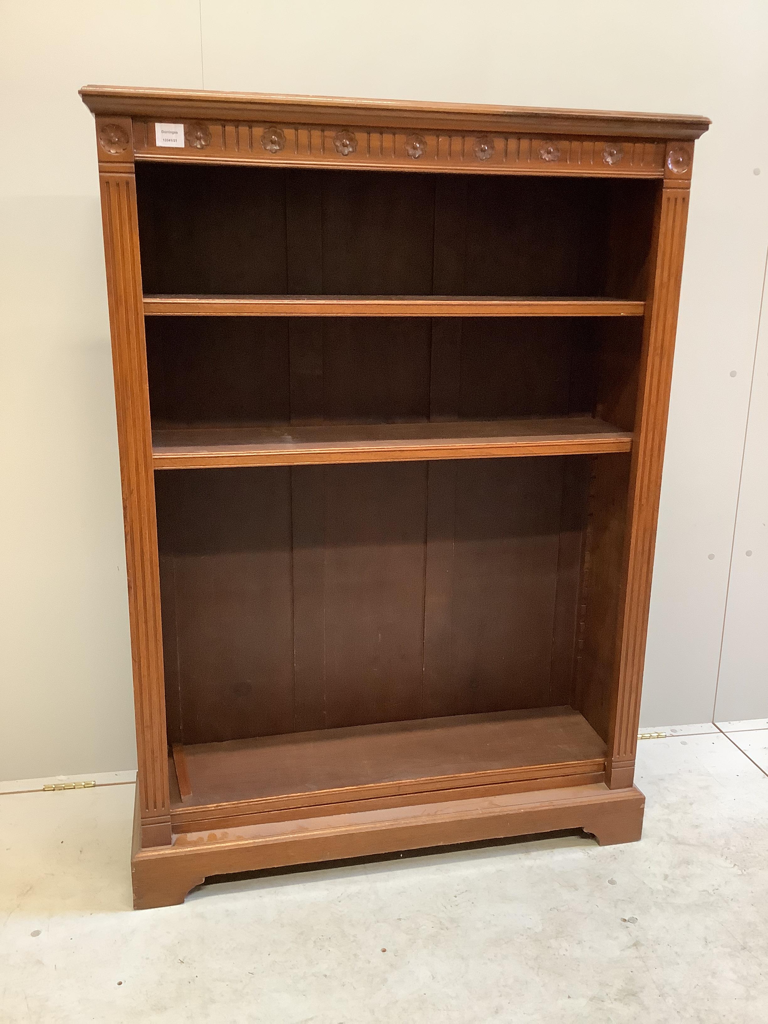 An Edwardian carved oak open bookcase, width 99cm, depth 30cm, height 138cm